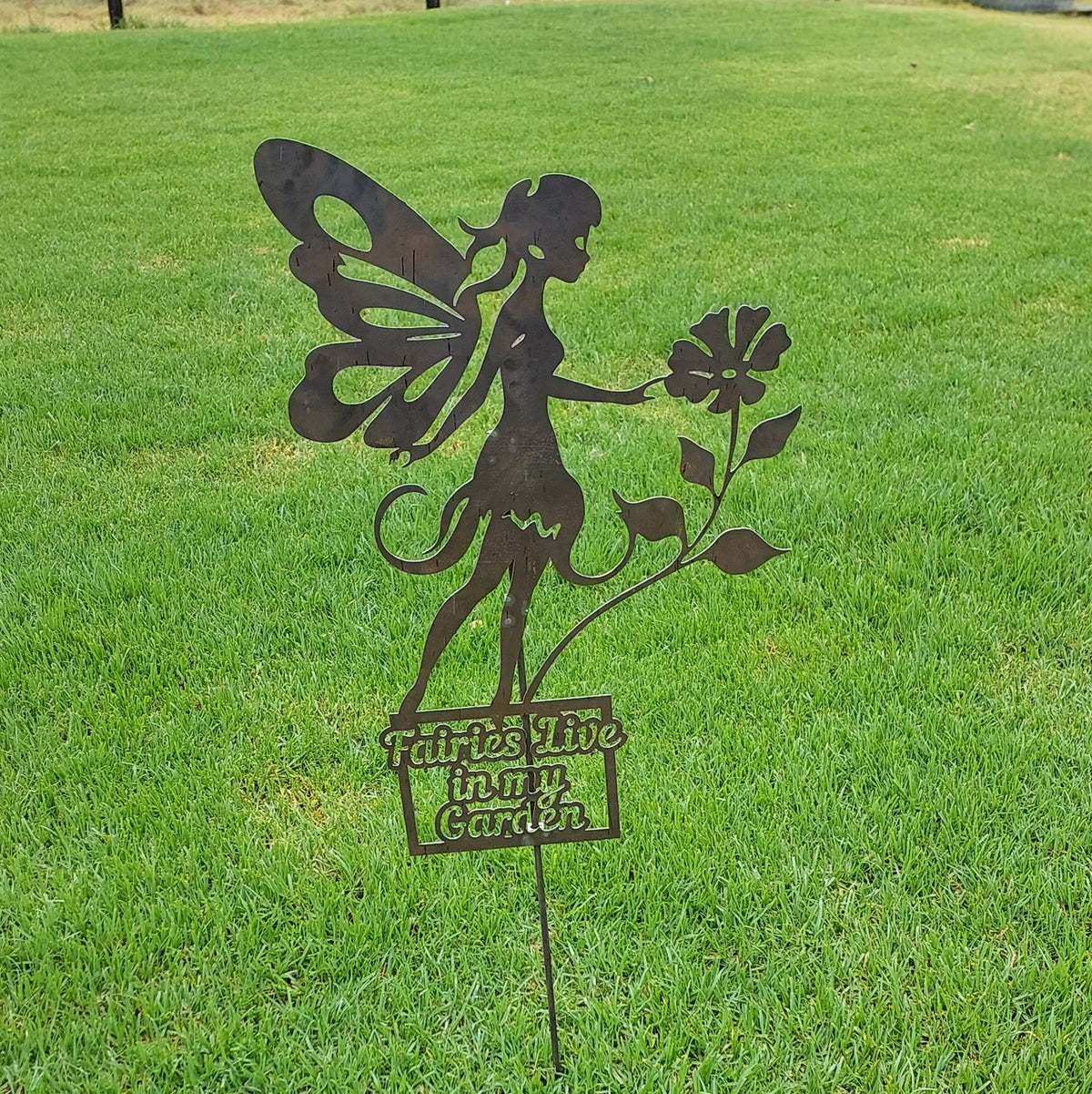 Garden Fairy with rose, sitting.