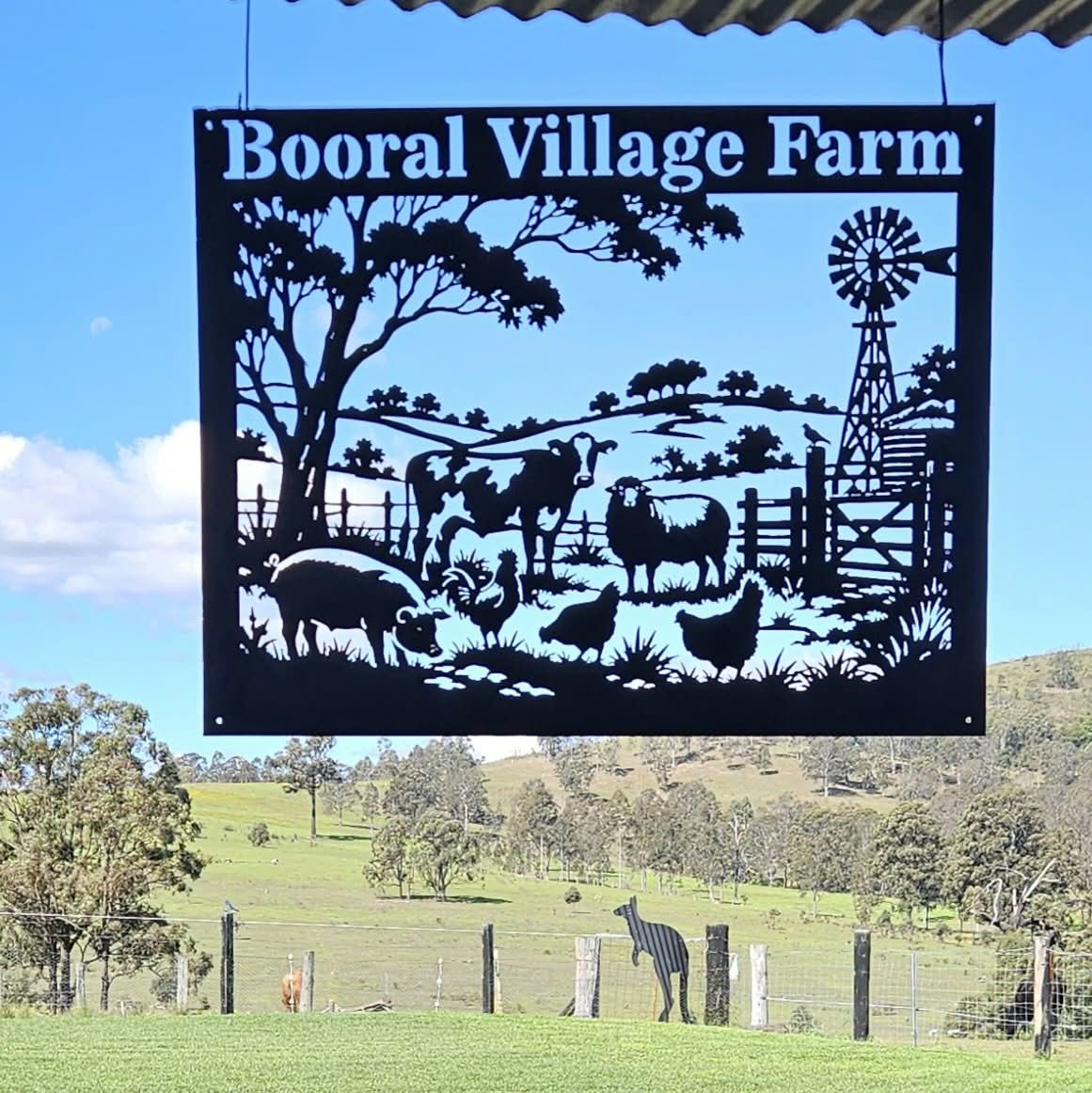 A Booral farm silhouette design with a windmill, trees, and various farm animals.
This one is approx 900mm x 700mm