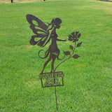 Garden Fairy with rose,  sitting.